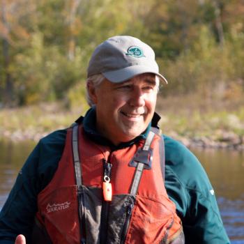 Blair wearing pdf smiling by the water