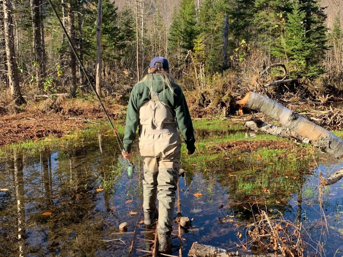 walking to fishing location on a small bridge